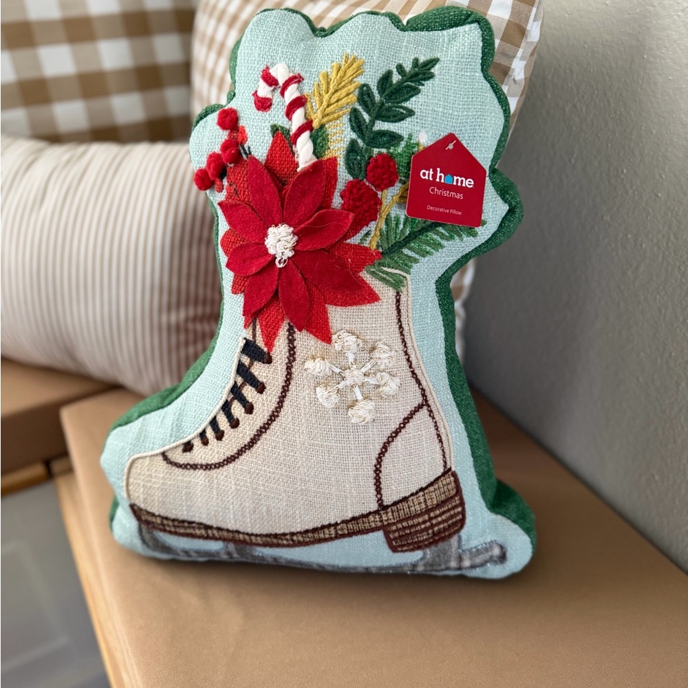 At Home Christmas Ice Skate Pillow with Red Poinsettia